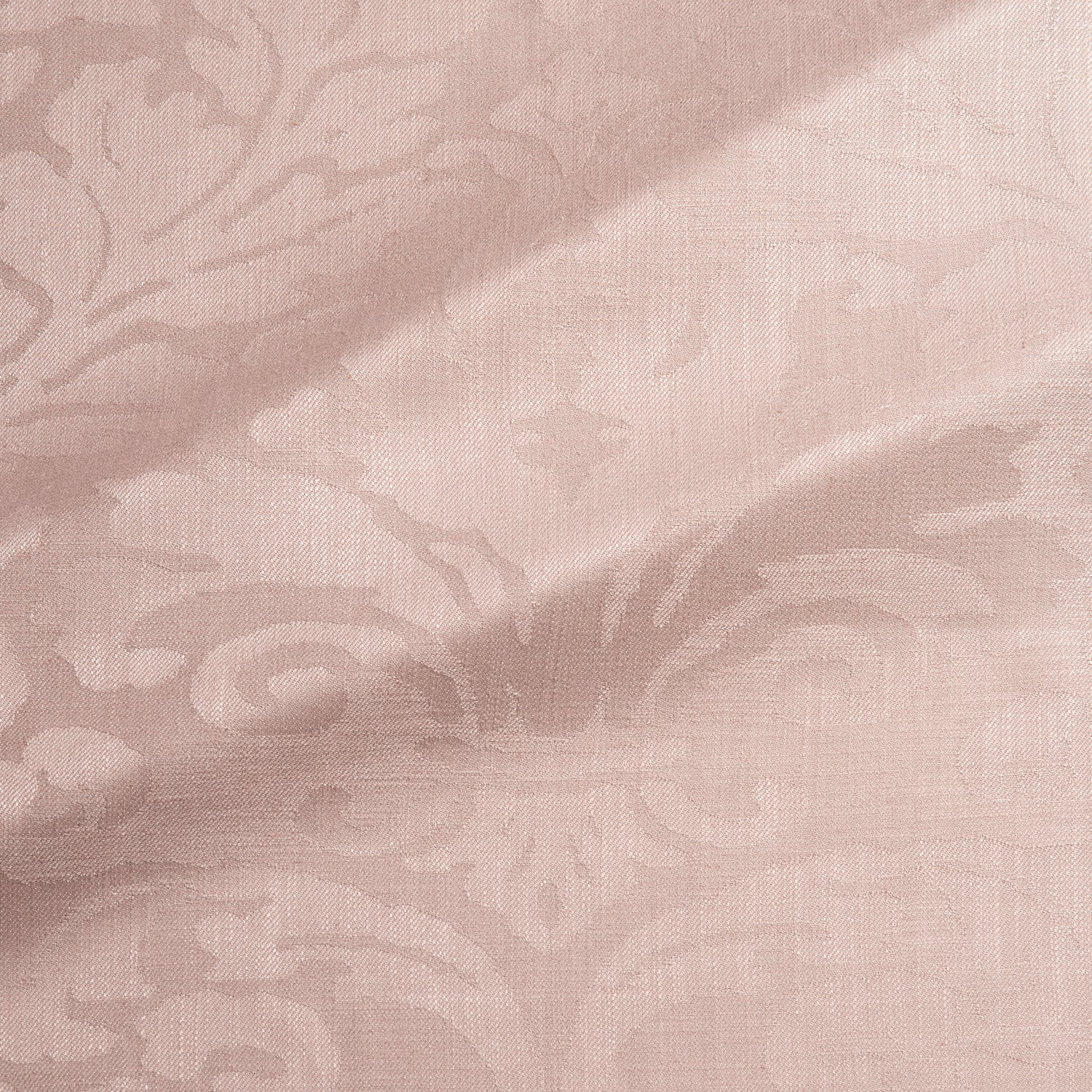 Fabric swatch of a contemporary damask fabric in a dusky pink colour for upholstery and curtains.