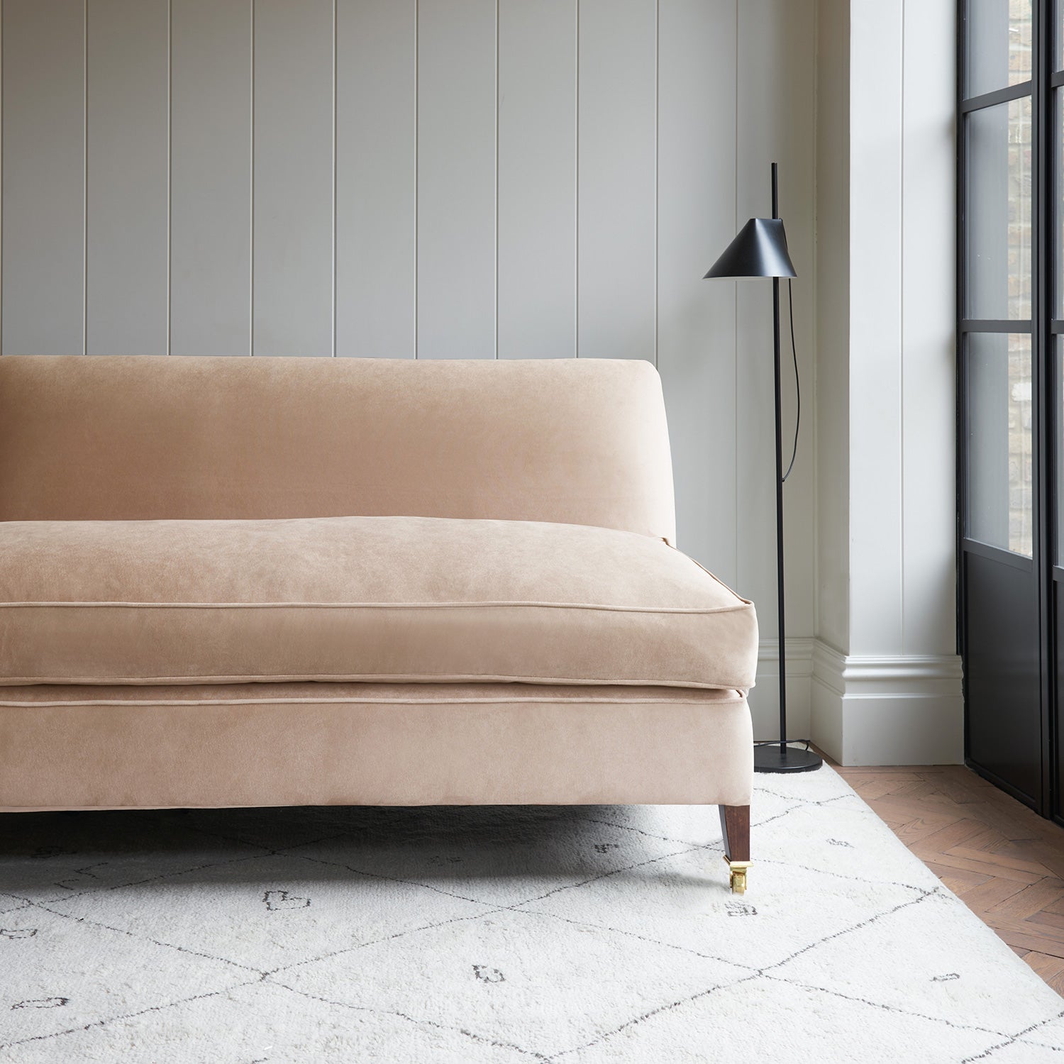 Pink velvet upholstery fabric on a classic sofa.