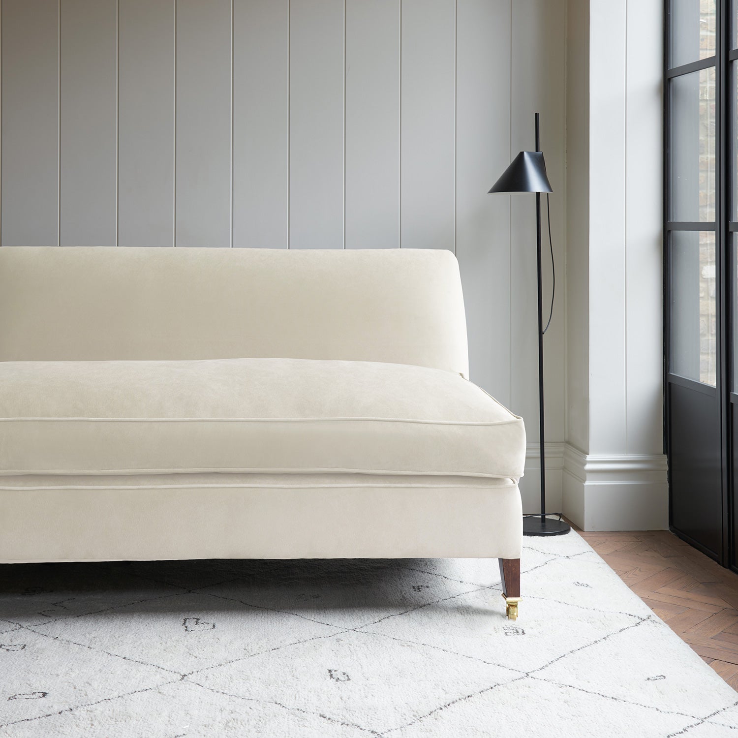 White velvet upholstery fabric on a classic sofa.