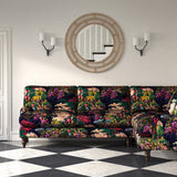 Sofa in printed velvet fabric with ornamental garden scenic design in multicolours.