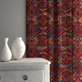 Curtains in printed velvet fabric – an exuberant carpet design in red colours.