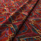 Printed velvet fabric – an exuberant carpet design in red colours for curtains and upholstery.
