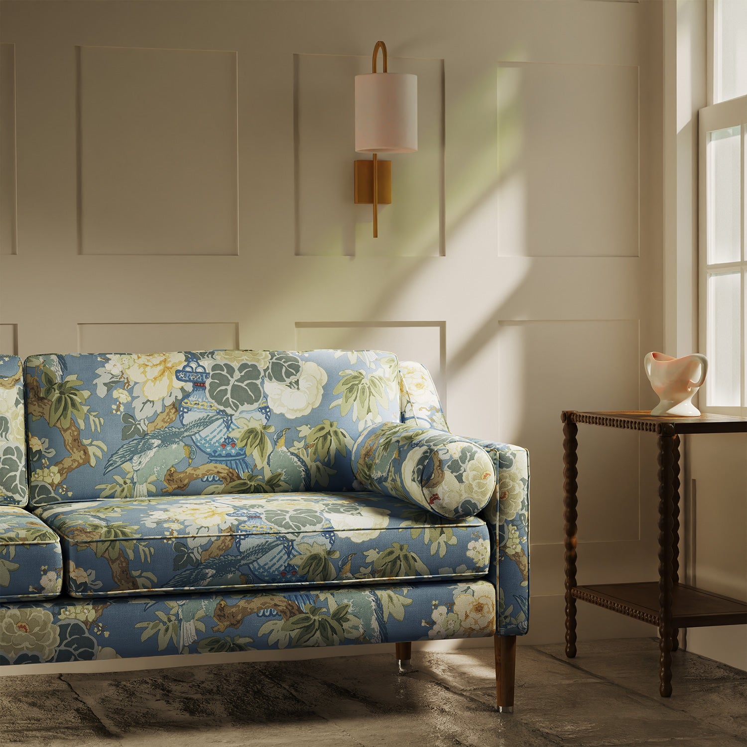Sofa upholstered in a linen fabric with a floral and bird design