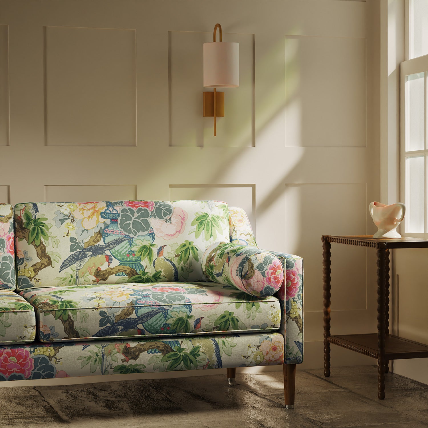 Sofa upholstered in a linen fabric with a floral and bird design