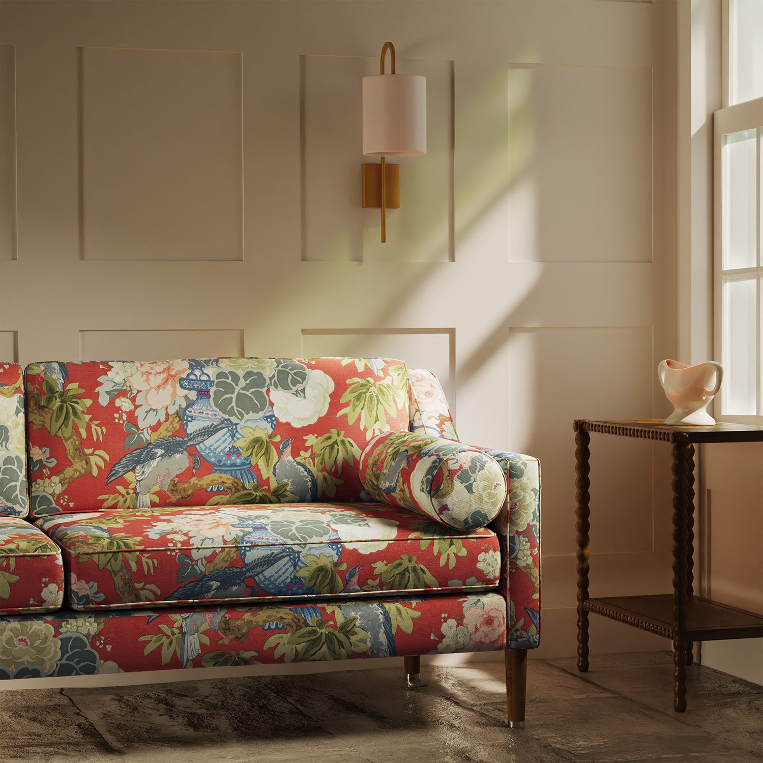 Sofa upholstered in a linen fabric with a floral and bird design