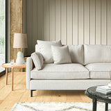 Sofa covered in a boucle fabric in Linen