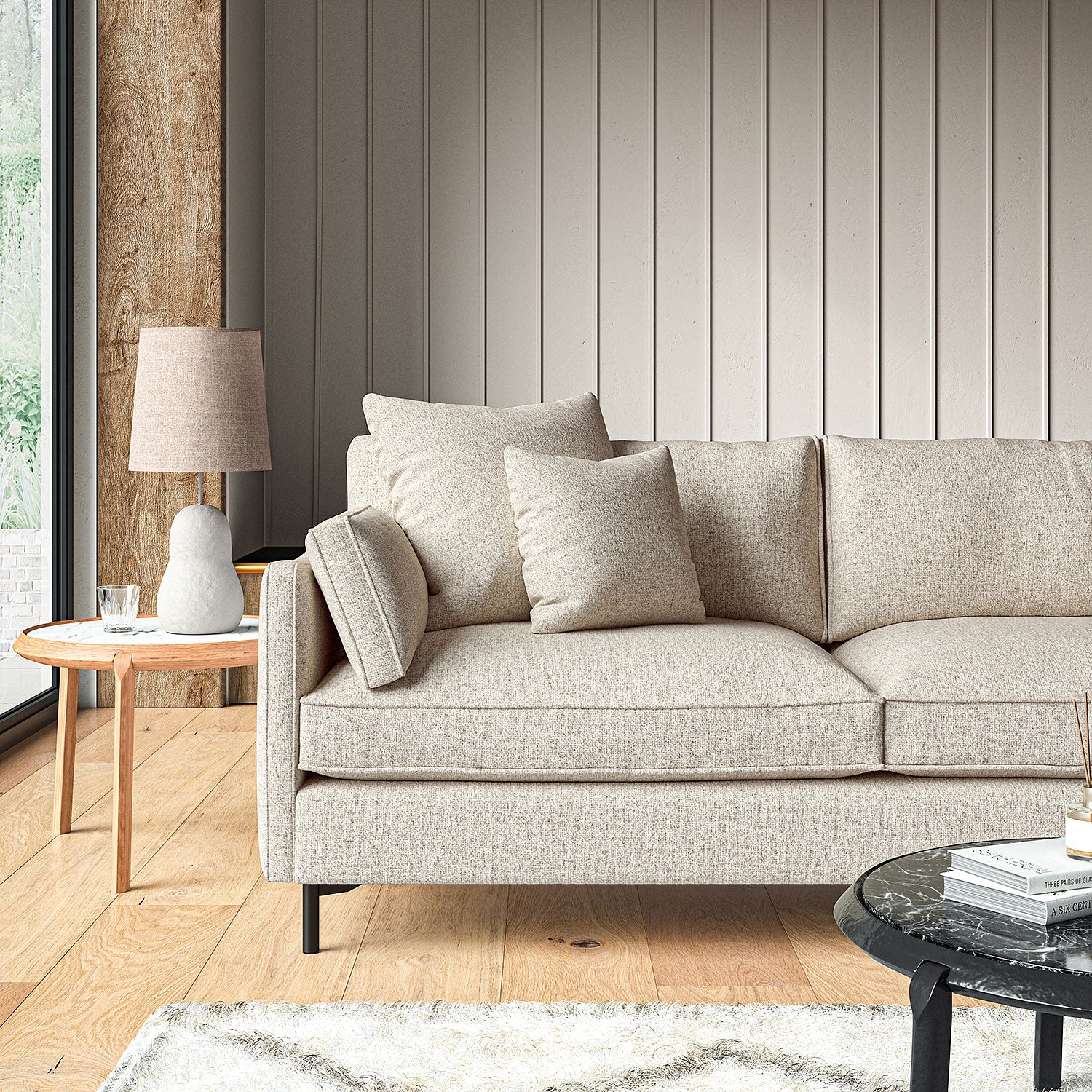 Sofa covered in a boucle fabric in Dove Grey