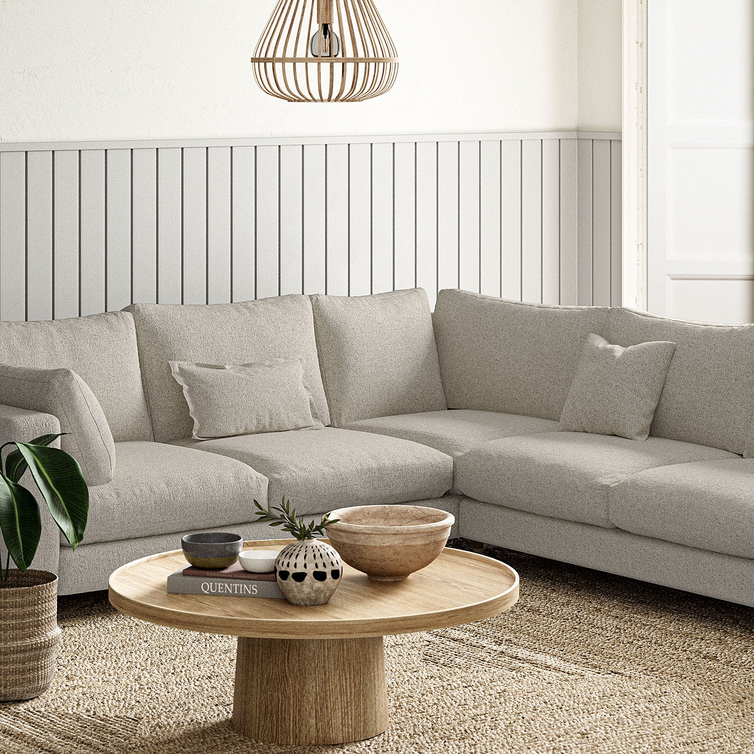Sofa covered in a boucle fabric in Dove Grey