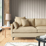 Sofa covered in a boucle fabric in Fudge