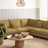 Sofa covered in a boucle fabric in Amber
