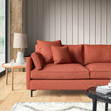 Sofa covered in a boucle fabric in Carnelian