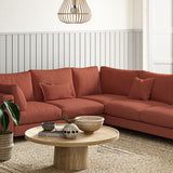 Sofa covered in a boucle fabric in Carnelian