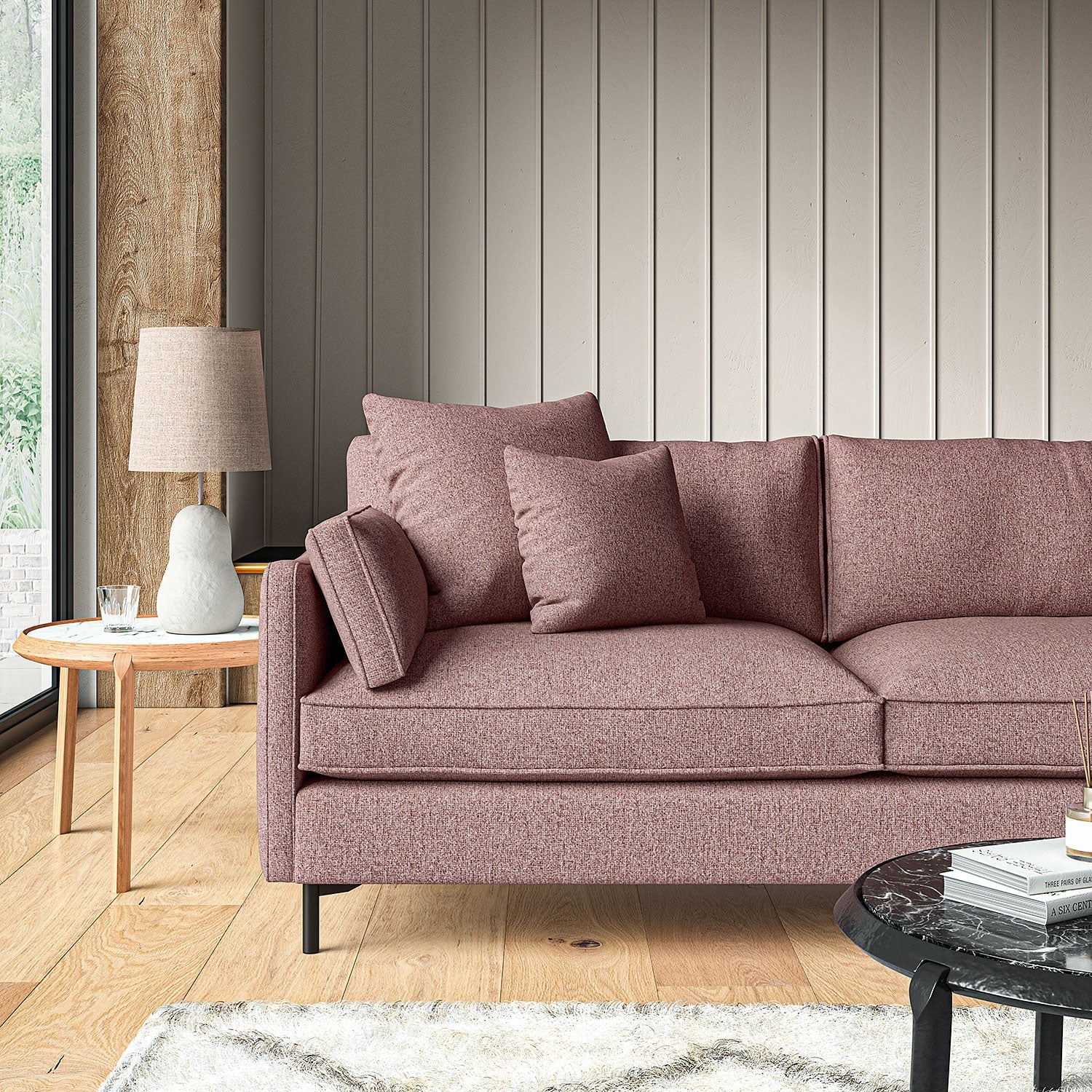Sofa covered in a boucle fabric in Heather