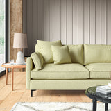 Sofa covered in a boucle fabric in Peridot