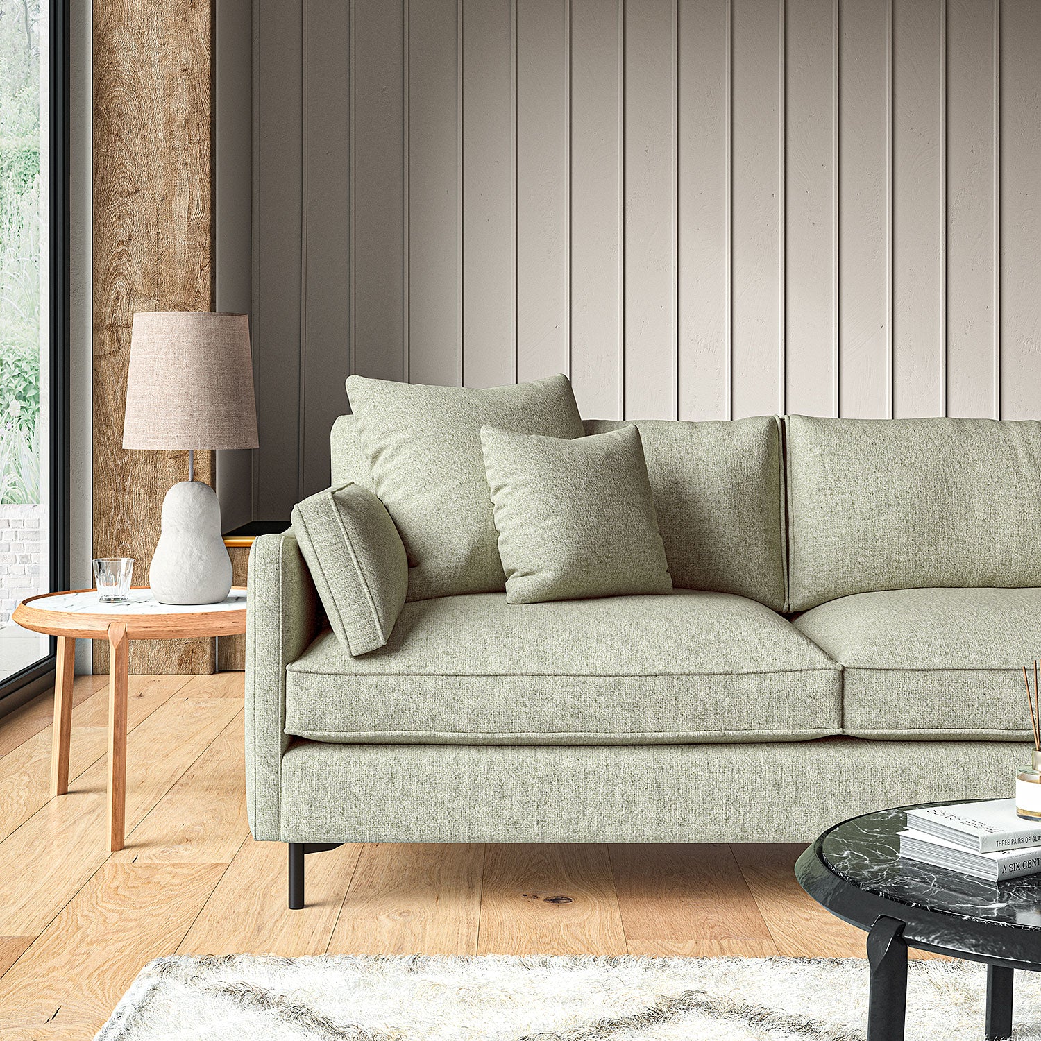 Sofa covered in a boucle fabric in Sea Salt