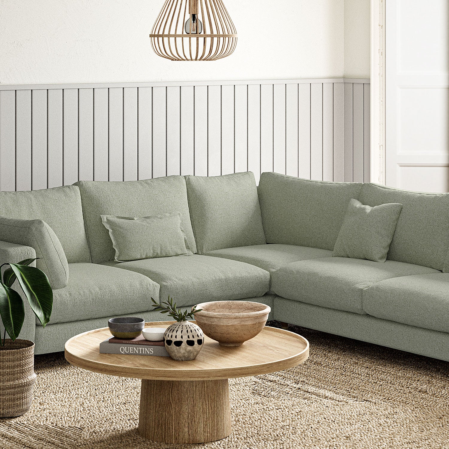 Sofa covered in a boucle fabric in Sea Salt