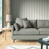 Sofa covered in a boucle fabric in Fossil