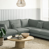 Sofa covered in a boucle fabric in Fossil