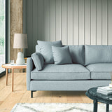 Sofa covered in a boucle fabric in Cornflower