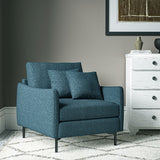 Chair covered in a boucle fabric in Sapphire