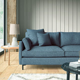 Sofa covered in a boucle fabric in Sapphire