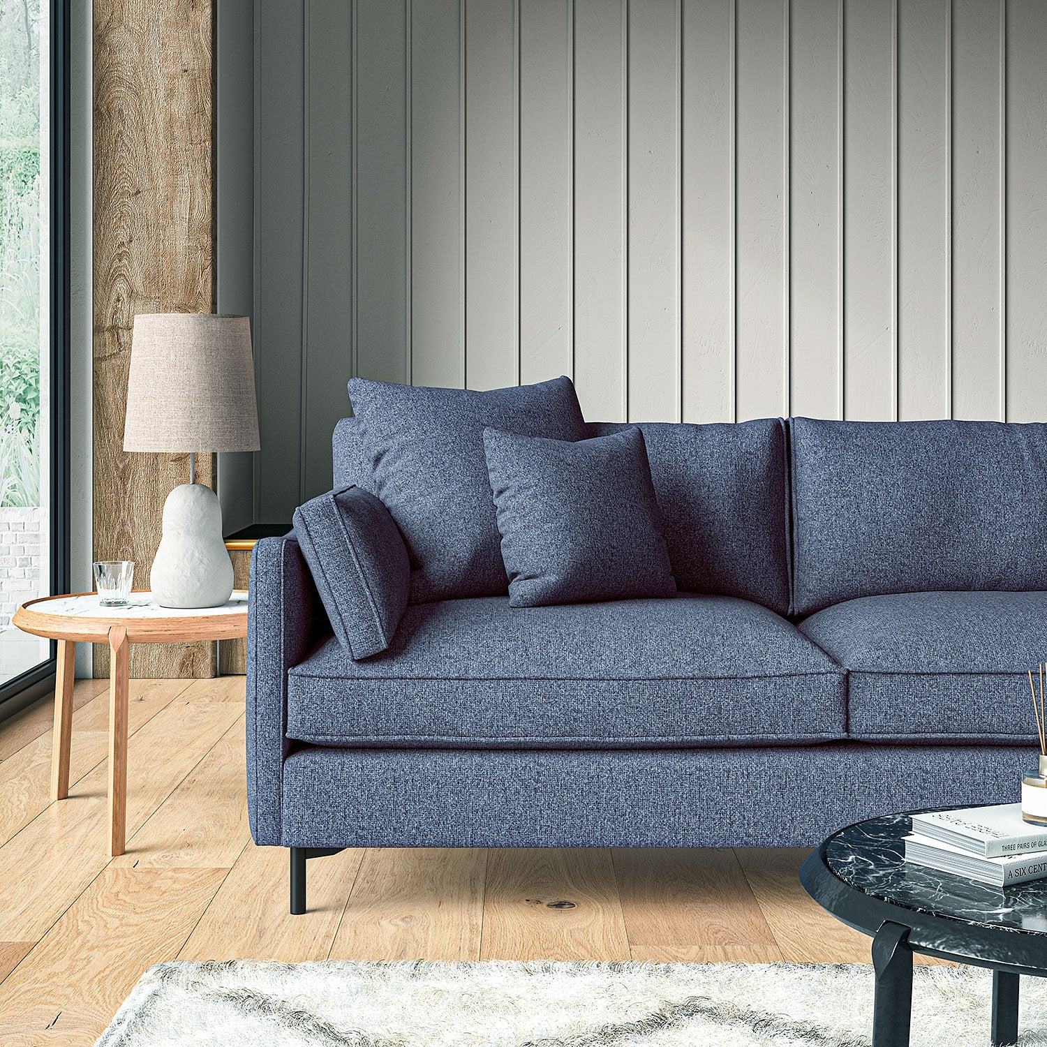 Sofa covered in a boucle fabric in Indigo