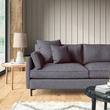 Sofa covered in a boucle fabric in Ink