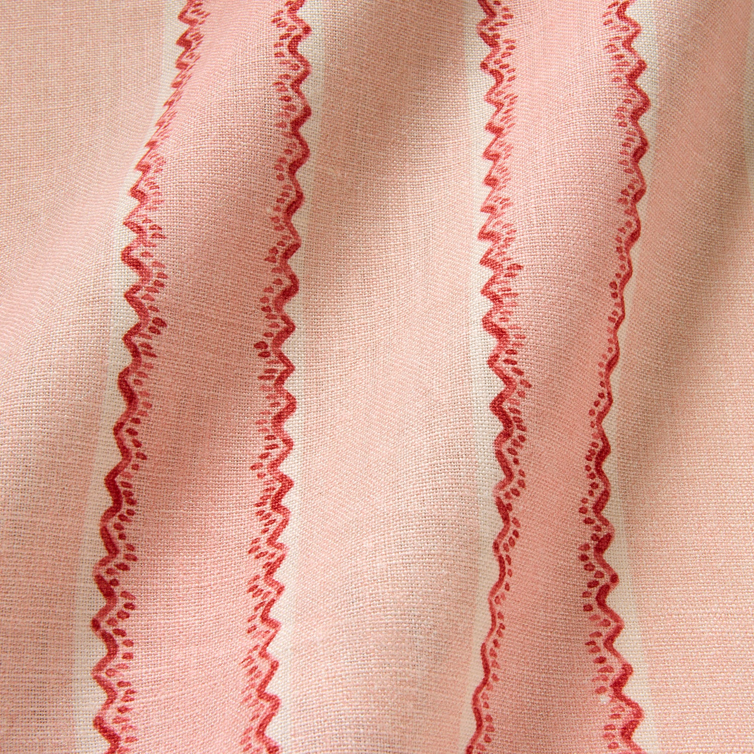 Printed linen fabric sample – a bold blocks of colour in this inviting stripe are softened with a painterly finish in pink, red and white