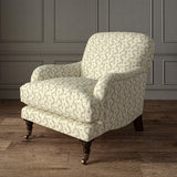 Printed linen fabric - a charming marine-style pattern in brown and cream – on an armchair