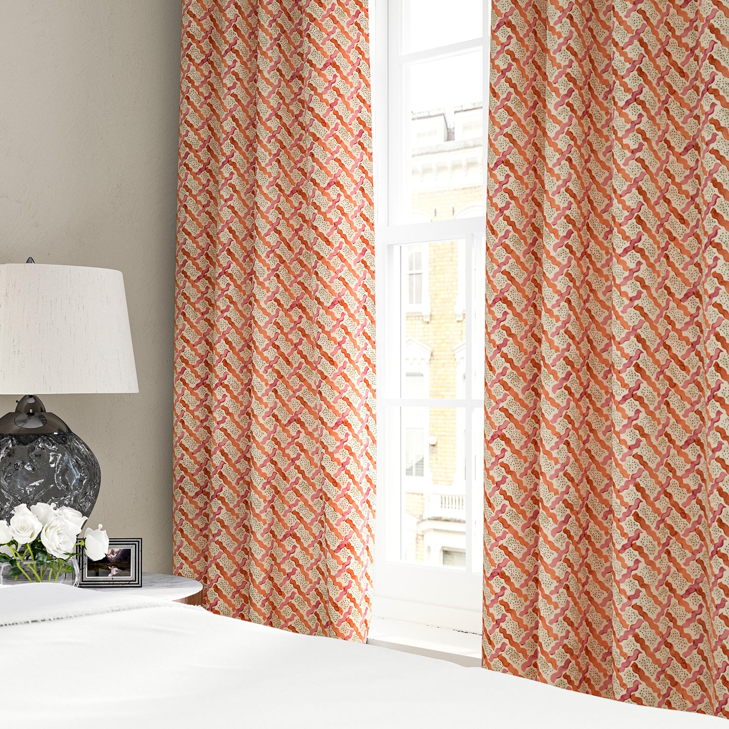Linen curtains with a contemporary lattice design in red, pink, cream and white