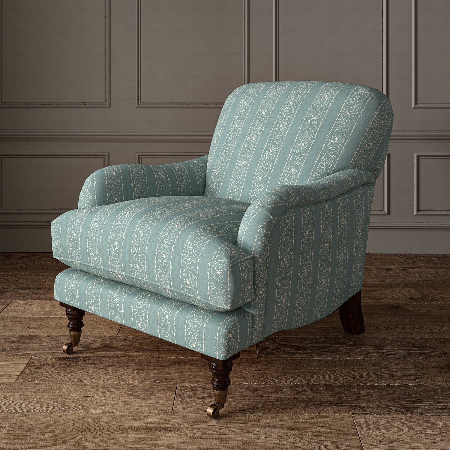 Printed linen fabric – a delicate pattern of moons and star-like dots in blue and cream – on an armchair