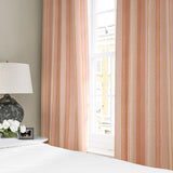 Linen curtains with a bold blocks of colour in this inviting stripe are softened with a painterly finish in pink, yellow and white