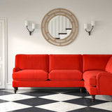 Sofa upholstered in a red velvet upholstery fabric
