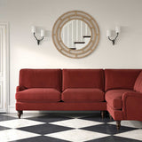 Sofa upholstered in a red velvet upholstery fabric