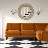 Sofa upholstered in a brown velvet upholstery fabric