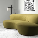 Sofa upholstered in a green velvet upholstery fabric
