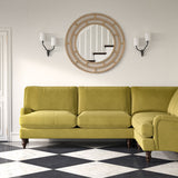 Sofa upholstered in a green velvet upholstery fabric