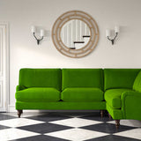 Sofa upholstered in a green velvet upholstery fabric