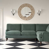 Sofa upholstered in a blue velvet upholstery fabric