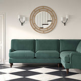Sofa upholstered in a blue velvet upholstery fabric