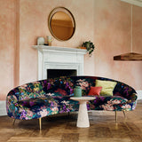 Sofa in printed velvet fabric with ornamental garden scenic design in multicolours.