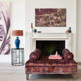 Stool in printed velvet fabric – an exuberant carpet design in red colours.