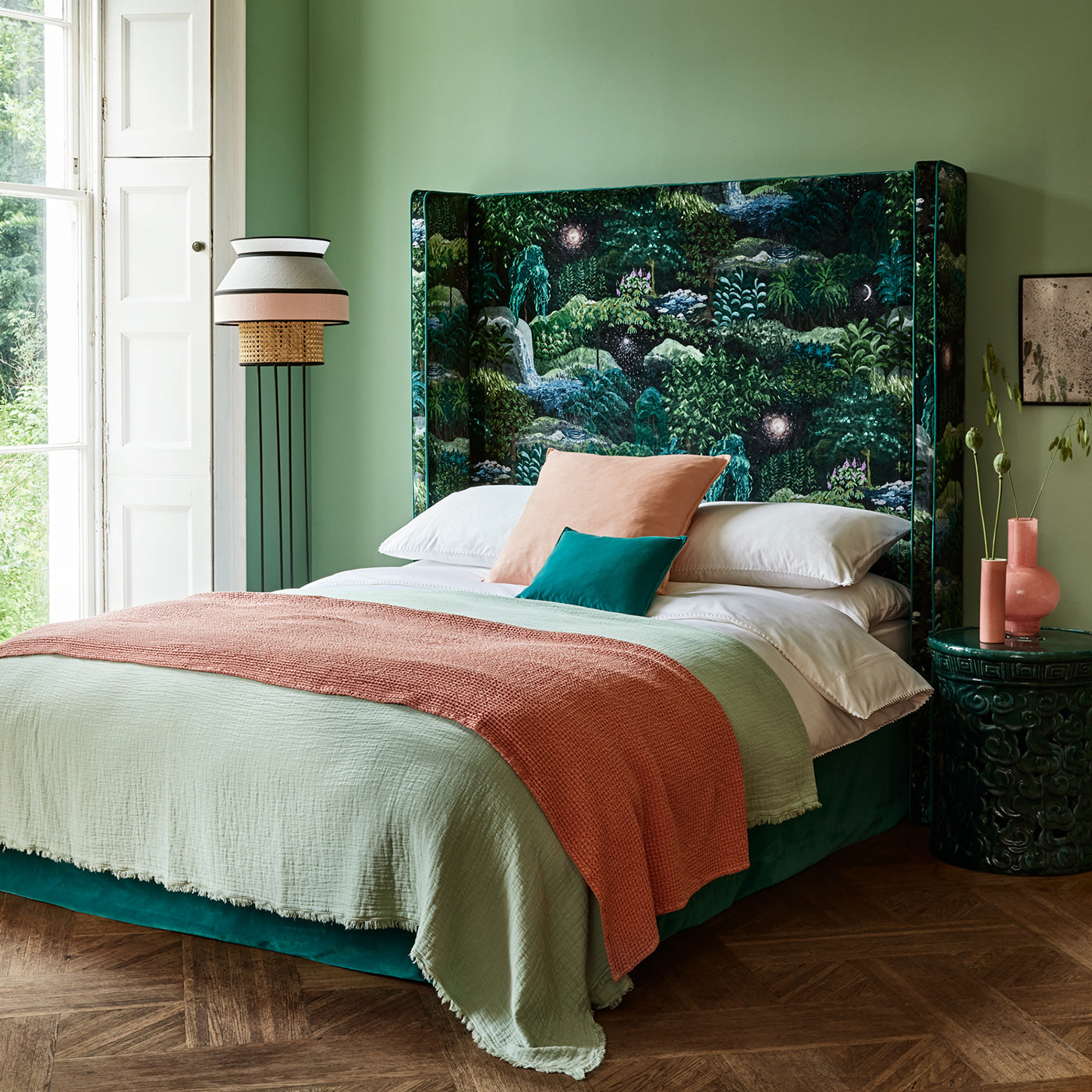 Headboard in printed velvet fabric with mysterious fantasy forest design, in green colours.