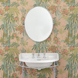 Bathroom featuring a tropical wallpaper with exotic, floral blossoms intertwined with bamboo.