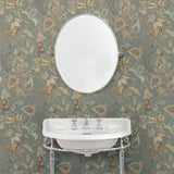 Bathroom with a tropical wallpaper in a smart neutral showcasing beautiful botanicals and butterflies.