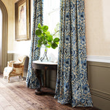 Curtains in velvet fabric with blue pheasant and floral design.