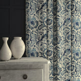 Curtains in velvet fabric with blue pheasant and floral design.