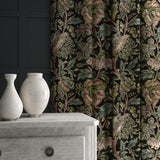 A printed velvet fabric showcasing an archival document, circa 1700s, this stylised floral is lavish, graceful, and timeless in brown, blue, pink and green, shown as curtains