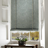 Blind in a blue and neutral printed linen fabric with a geometric pattern