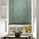 Blind in a blue and neutral printed linen fabric with a geometric pattern